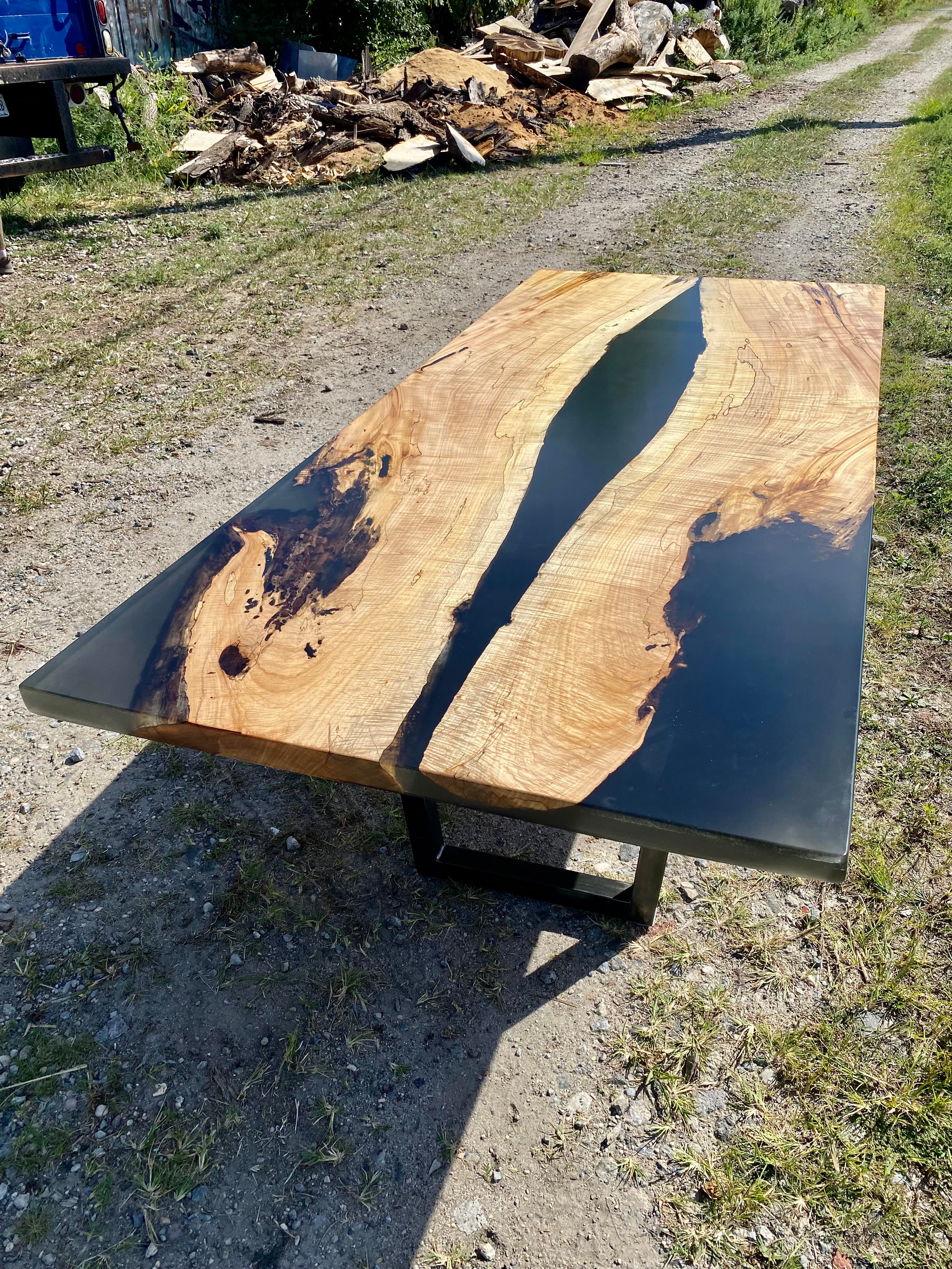 Refurbishing a cracked rustic oak table using black epoxy resin 